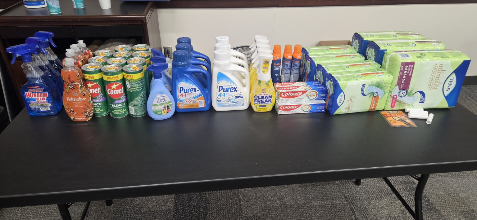 Cleaning, laundry, dental-care and personal-care essentials arranged for participants