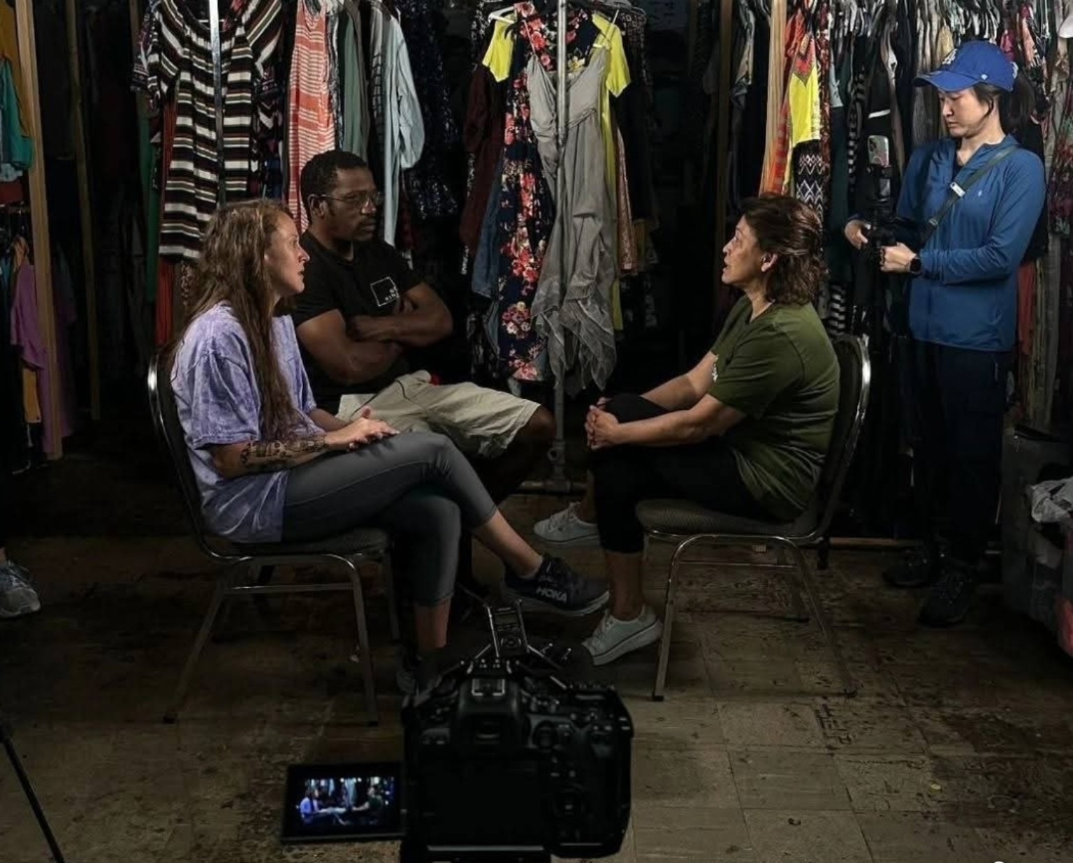 Ashley Griffice speaking with Mai Whelan during filming inside Be Kind Birmingham’s clothing space